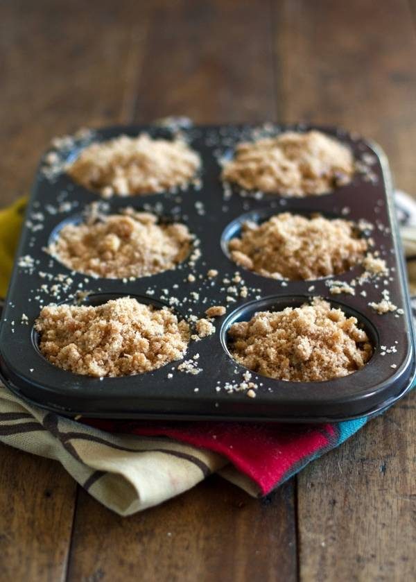 Whole wheat chocolate chip banana peanut butter muffins in a muffin tin.