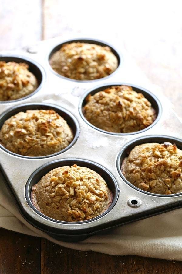 Caramelized Banana Oat Muffins in a muffin tin.