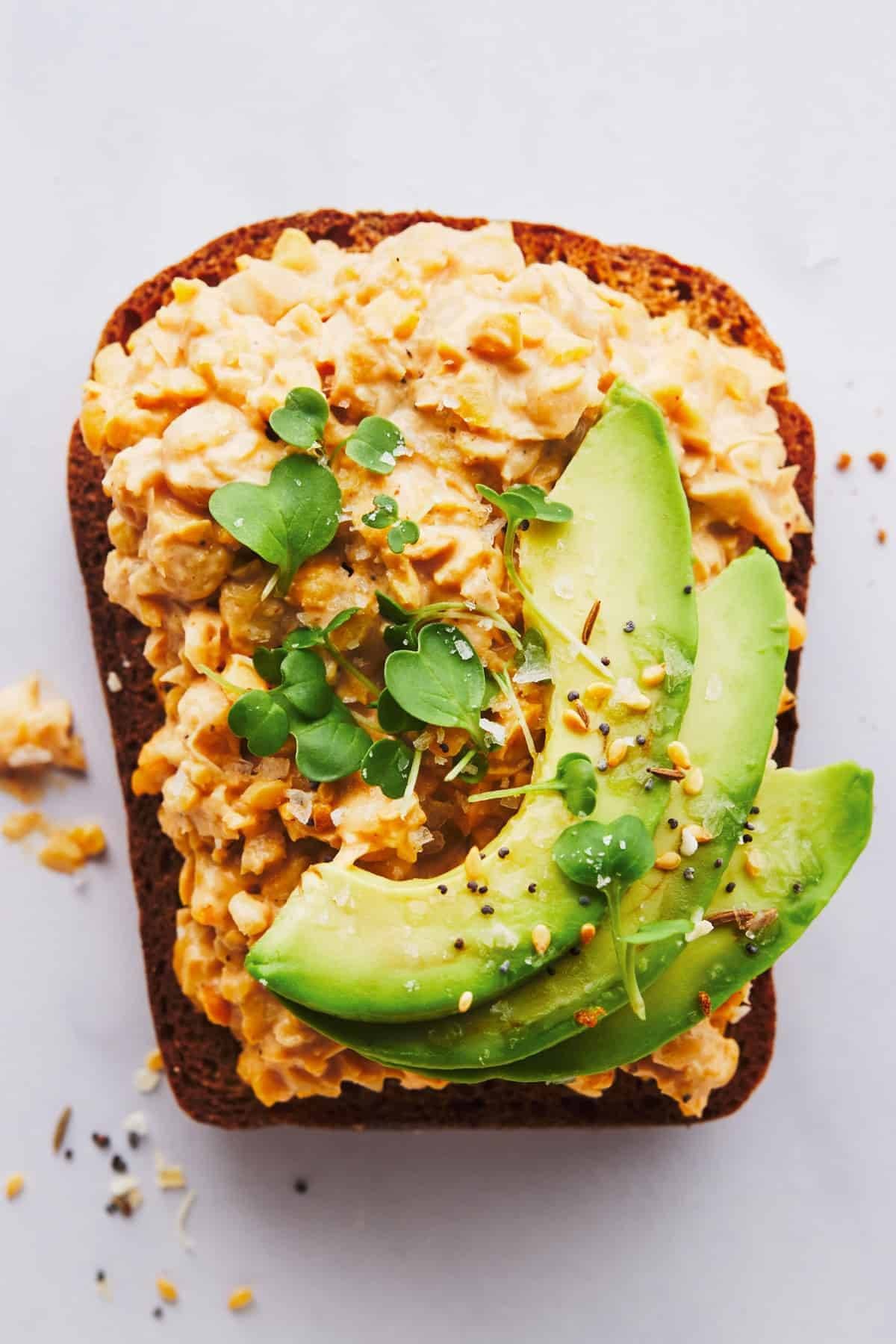 Chickpea salad on toast with avocado.