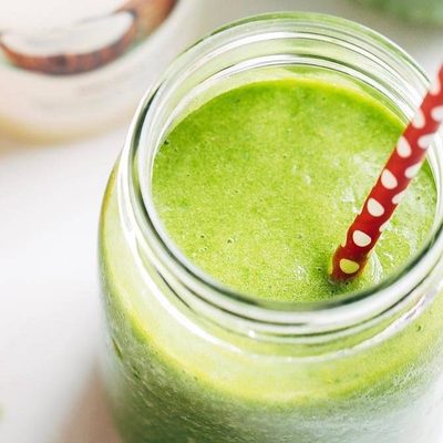 Simple Coconut Green Smoothie in jars with straw.