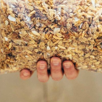 Cabin Granola in a bowl with yogurt and berries.