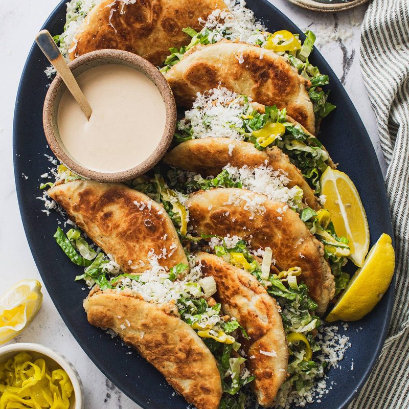 Caesar smash tacos on a plate.