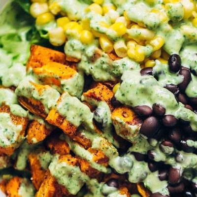 Spicy Southwestern Salad in a bowl with avocado dressing.