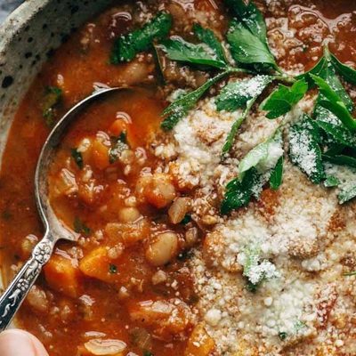 Instant Pot Minestrone Soup in bowl with spoon and bread.