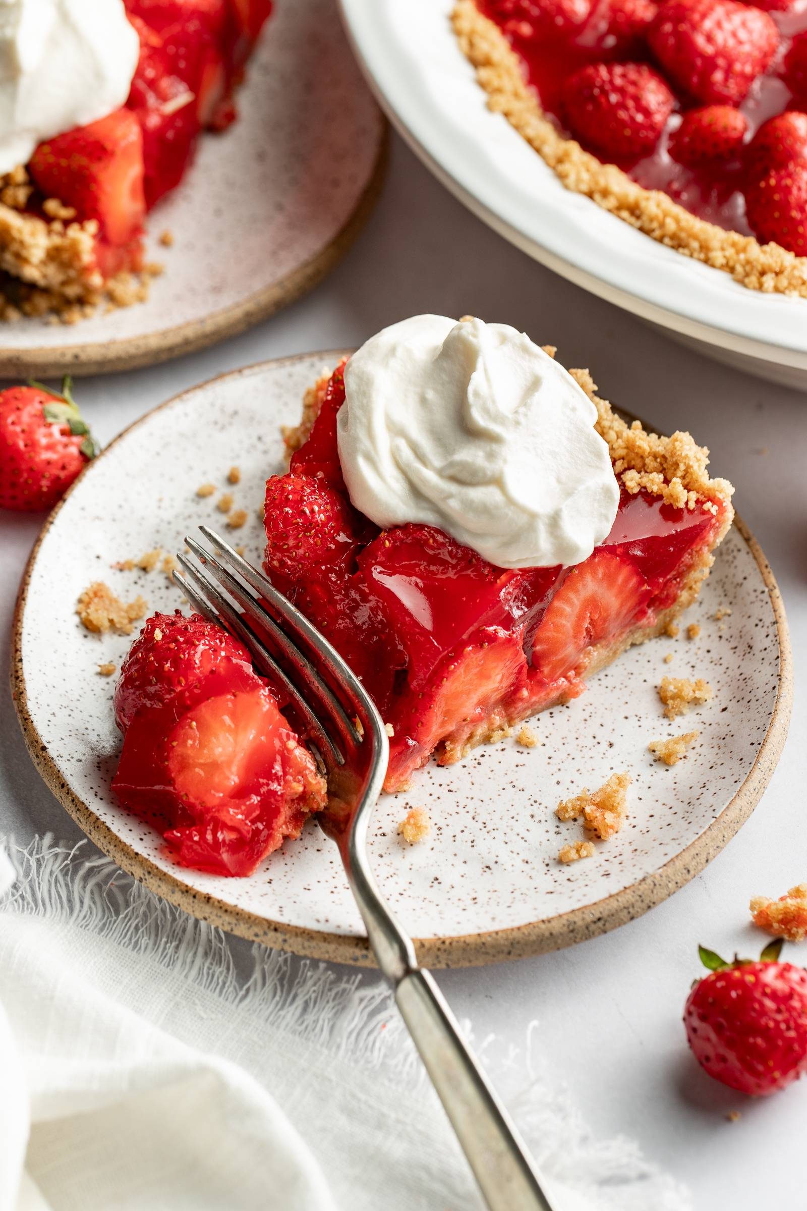 Strawberry pie on a plate.