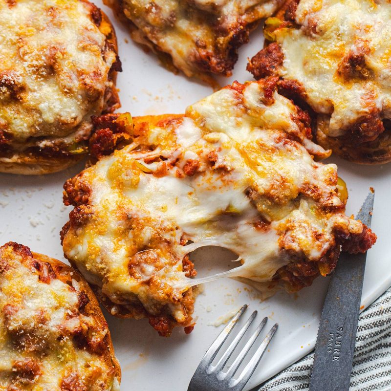 Pizza burgers on a tray.