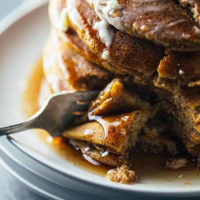 Cinnamon Pumpkin Pancakes cut with bite taken out.
